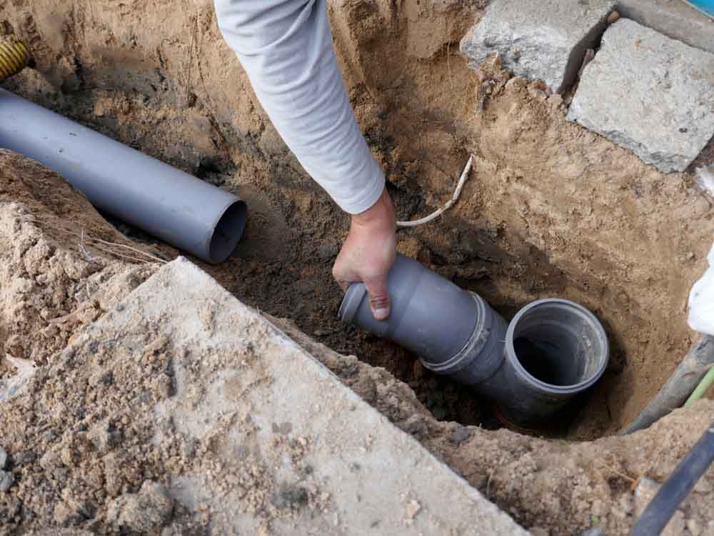 Laying,And,Installation,Of,A,Sewer,Pipe Laying and installation of a sewer pipe