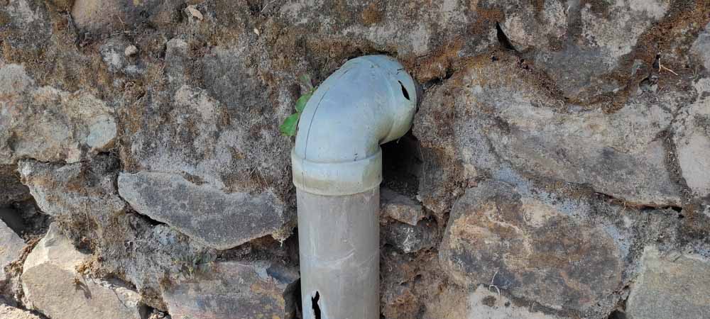 closeup of a cracked sewer pipe closeup of a cracked sewer pipe